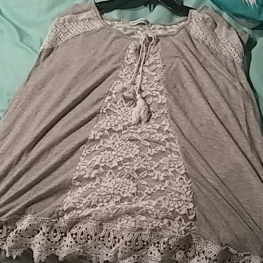 A grey lace shirt